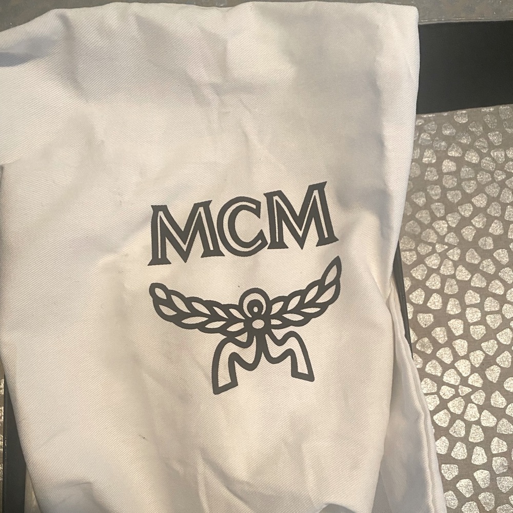 Women size 7 black and white MCM sneakers